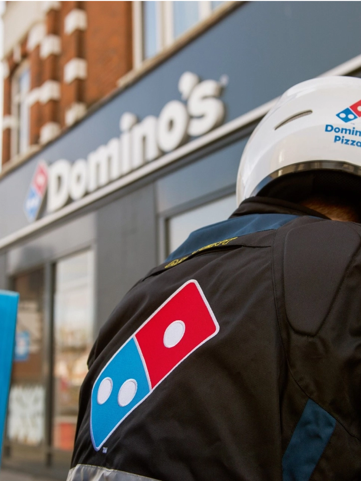 Dominos delivery person with branded motojacket